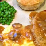 What is better than juicy Pork Chops with White Wine Mushroom Sauce served with Cheesy Grits? Best comfort food for any day of the week. | www.dadwhats4dinner.com