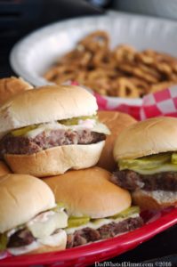 Spicy Beer Bratwurst Sliders combines three classic tailgating foods: Beer, Bratwurst and Hamburgers in a little slider that packs a nice spicy kick.