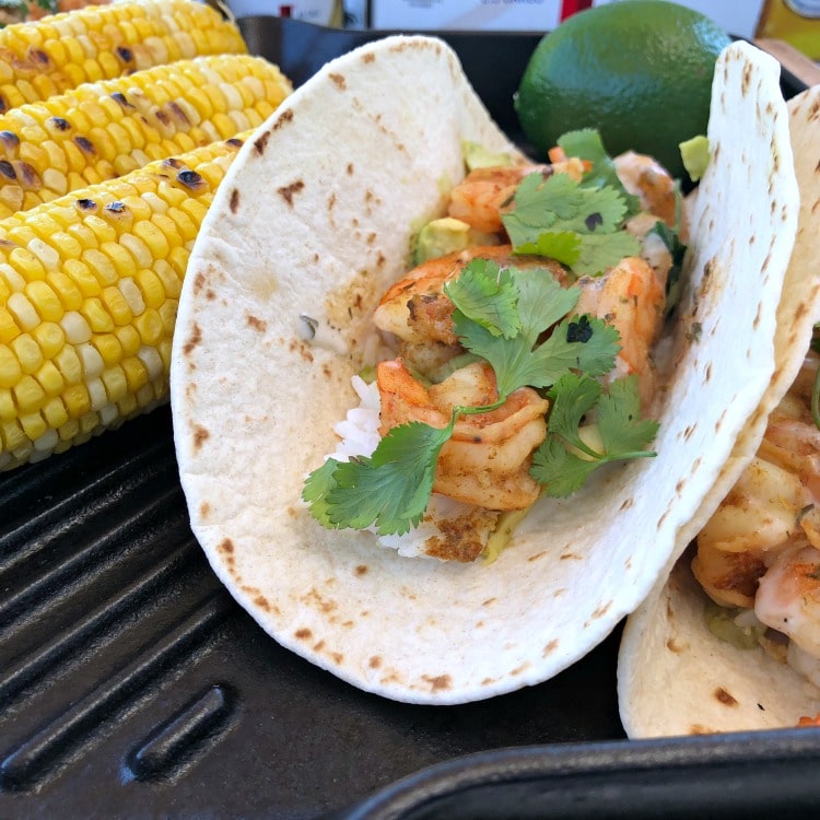 These healthy Grilled Chipotle Beer and Shrimp Tacos with avocado and rice are full of smokey spicy flavor and perfect for a light lunch when working outdoors in the summer.